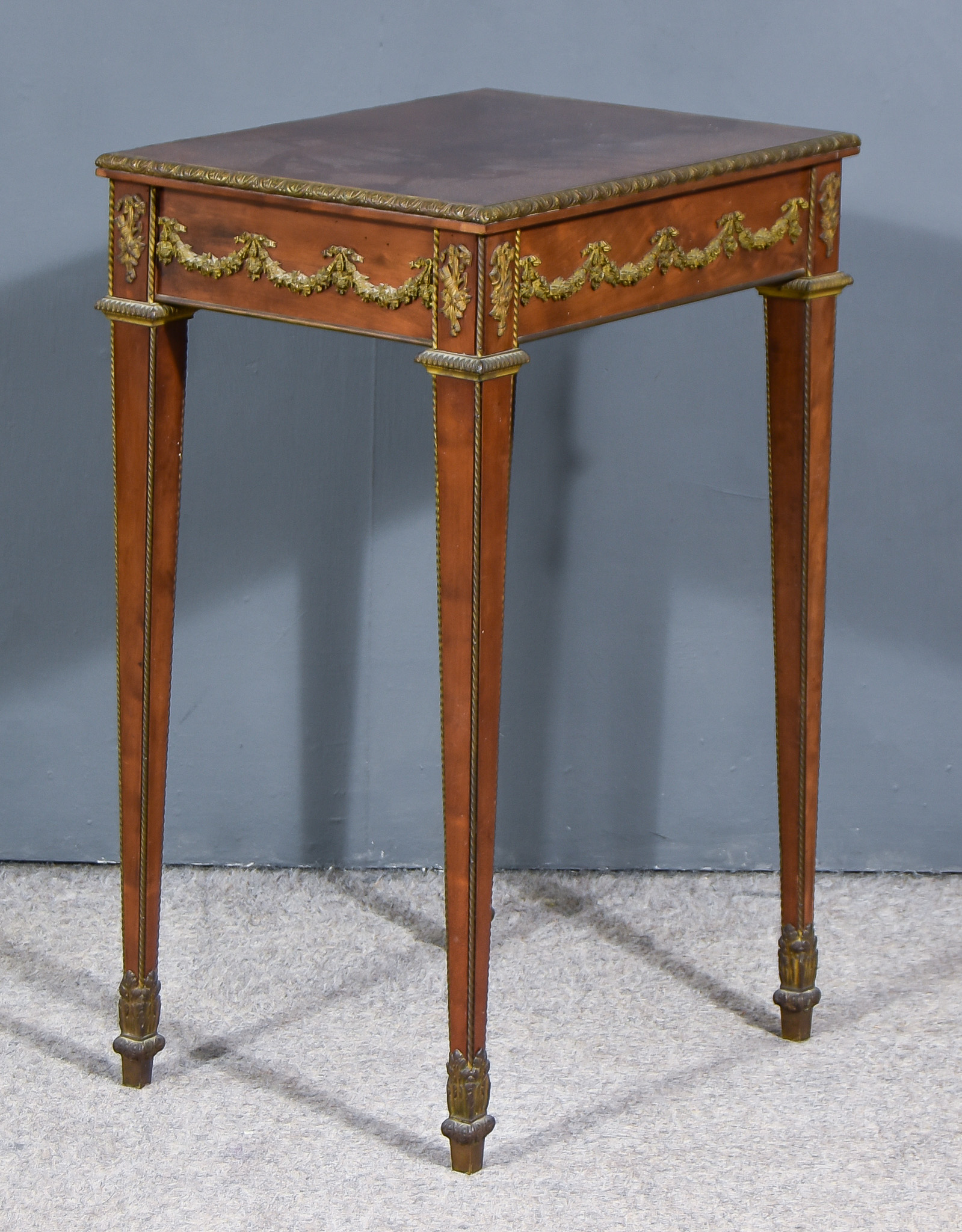 A 19th Century French Mahogany Rectangular Occasional Table, with gilt bronze mounts, cast with