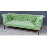 A 19th Century Mahogany Chesterfield Settee, upholstered in green cloth, the back buttoned, on
