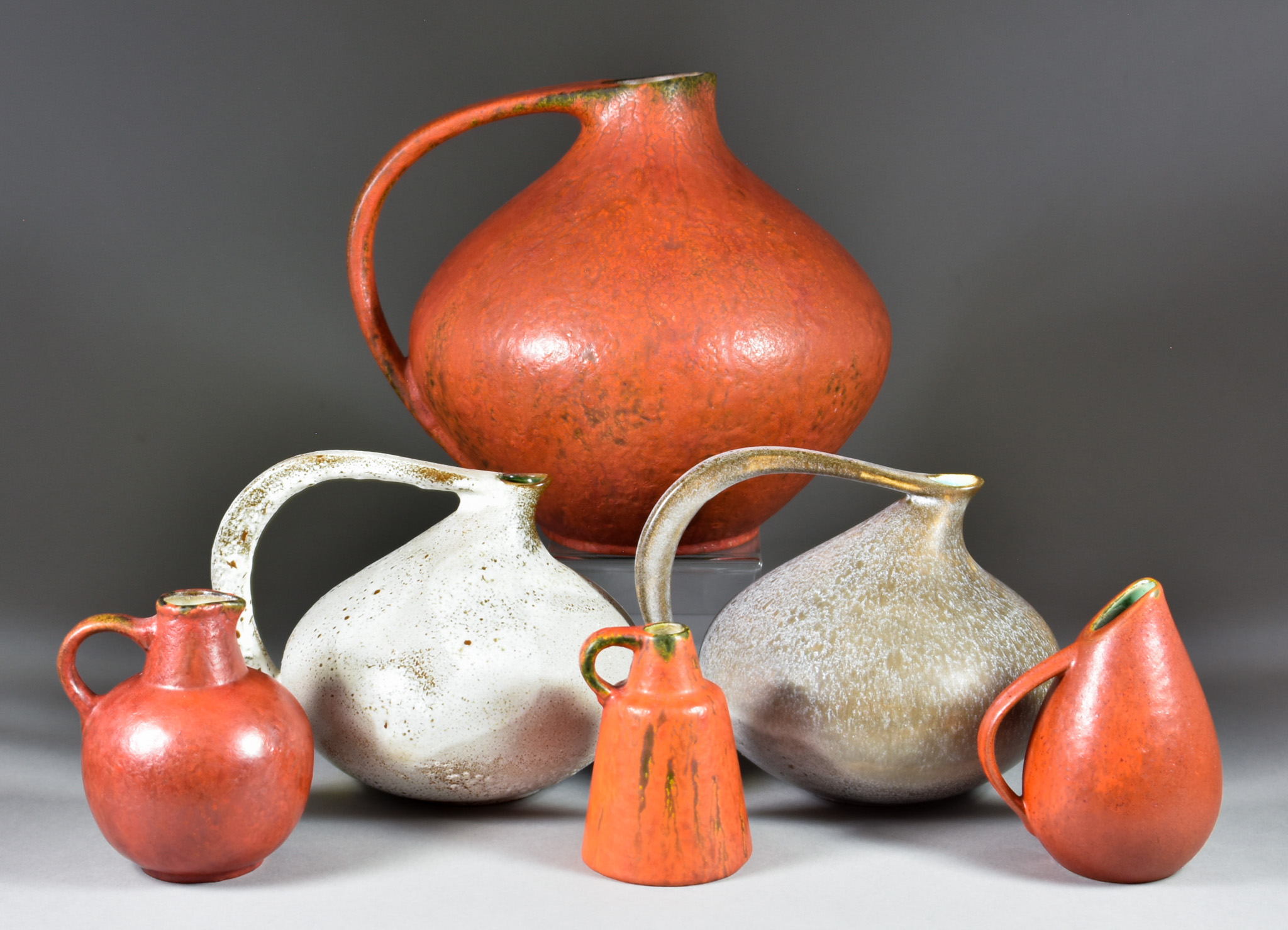 Uebelacker Pottery/U-Keramik, circa 1950s, Four vessels in Fiery Glaze, comprising - bulbous one-