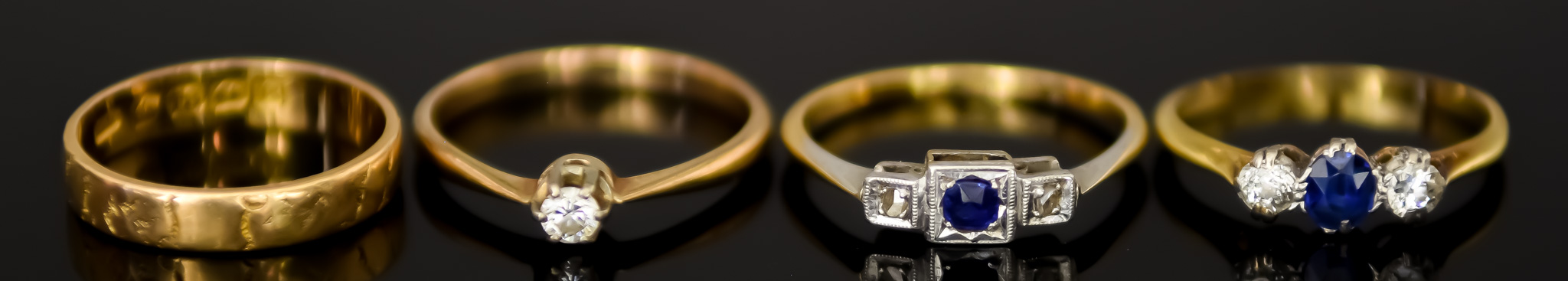 Four 18ct Gold Rings, comprising - one set with small solitaire diamond, approximately .15ct, size