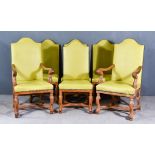 A Set of Six Oak High Back Dining Chairs, including two armchairs, with arched tops, upholstered