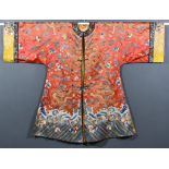 A Chinese Silk Robe, Late 19th/Early 20th Century, embroidered in coloured silk and gold threads