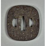 A Japanese Iron Tsuba, Hizen School Kaku Maru-gata depicting a dragon and clouds, 2.5ins diameter,