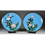 A Pair of Japanese Cloisonné Enamel Circular Dishes, decorated with mixed floral sprays on a