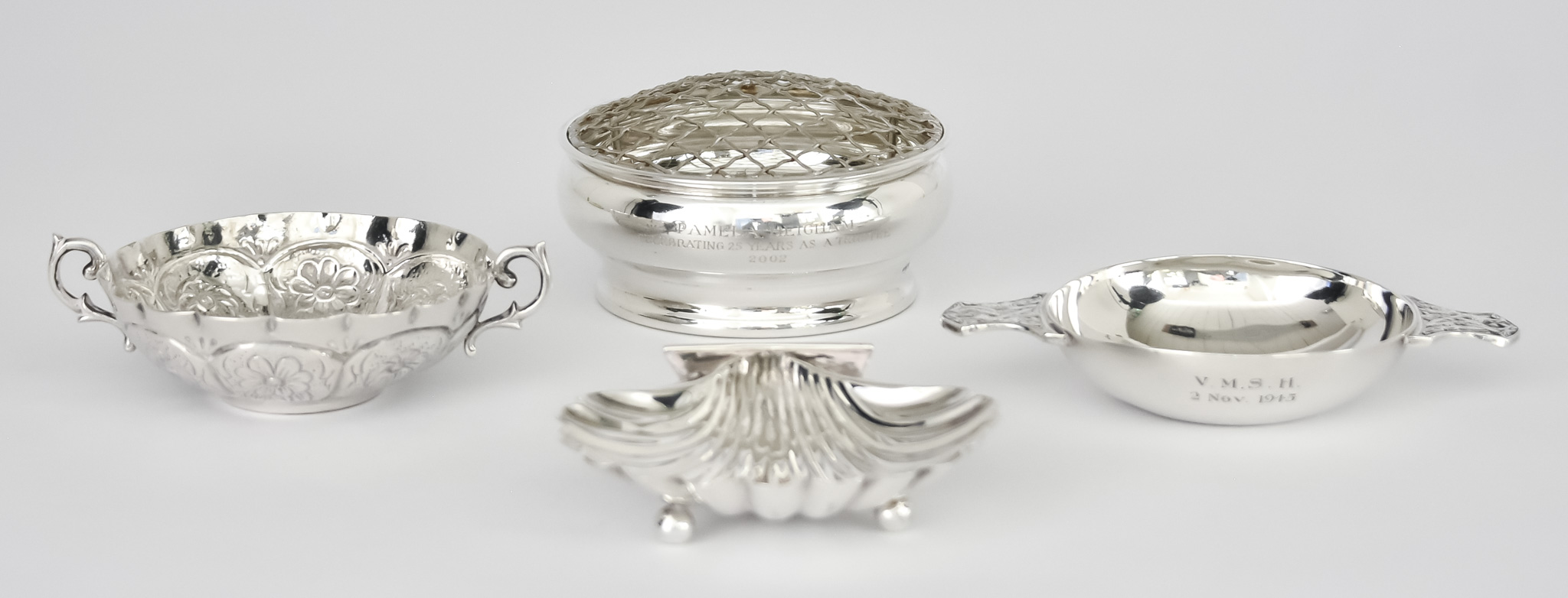 A Sterling Silver Butter Shell and Three Other Items of Silver, the butter shell by Cartier, stamped