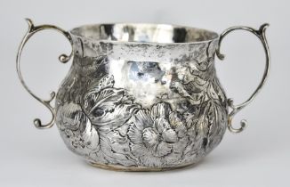A 17th Century Silver Two-Handled Porringer with partial and worn marks, the bulbous body embossed