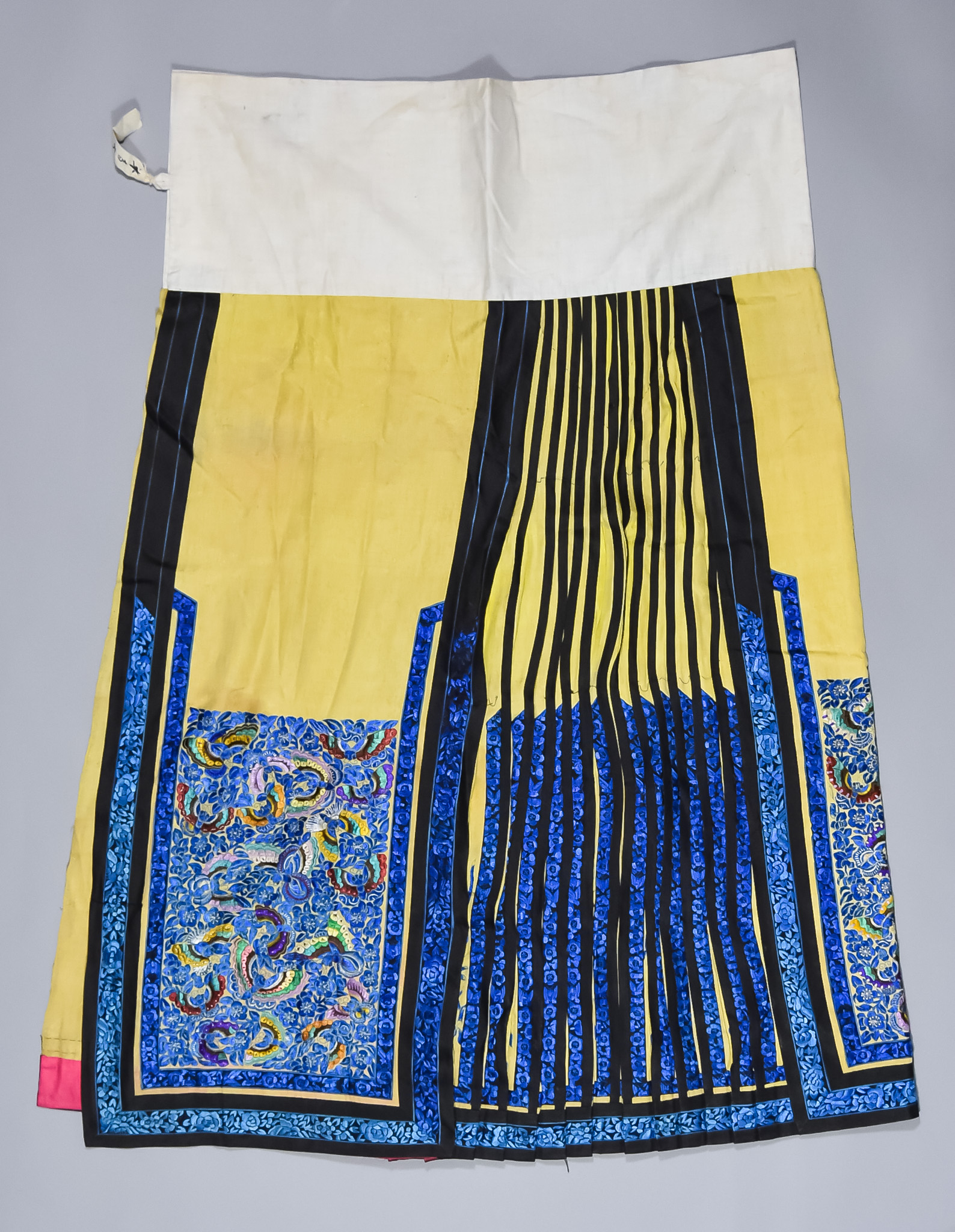 Two Chinese Silk Embroidered Skirts, Late 19th/Early 20th Century, one in soft yellow worked in