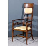 An Edwardian Mahogany High Back Armchair of Art Nouveau Design, inlaid with bandings and
