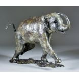 C W (20th/21st Century) - A bronze limited edition figure of a running elephant, No.1/9, monogrammed