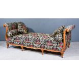 A Walnut Framed Day Bed, with moulded scroll ends, upholstered in floral tapestry, on short cabriole