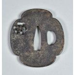 A Japanese Iron Tsuba, Katchushi School Mokko-gata pierced depicting Katabami Mon, Edo period (