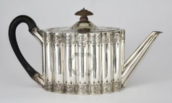 A George III Silver Oval Teapot, by Henry Chawner, London 1788, of reeded form, engraved with