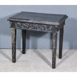 A 19th Century Ebonised Rectangular Occasional Table, with carved frieze, on square tapered legs