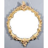 A 19th Century Gilt Framed Circular Wall Mirror, with shell scroll and floral frame and inset with