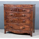 A George III Mahogany Chest, with rounded edge to top, fitted three frieze drawers with cross banded