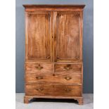 A George III Gentleman's Mahogany Wardrobe, the upper part with moulded dentil cornice, fitted