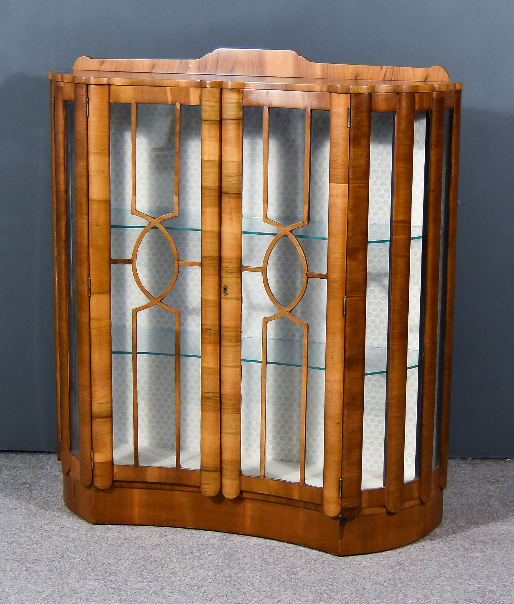 A 20th Century Figured Walnut Display Cabinet of "Art Deco" Design, fitted three glass shelves