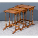 A Nest of Three Mahogany Rectangular Occasional Tables, with quarter veneered panelled tops on