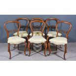 A Set of Six Victorian Mahogany Balloon Back Dining Chairs, with moulded frames, fretted and