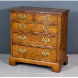 An Early 20th Century Figured Walnut Chest of 18th Century Design, the cross banded top with moulded