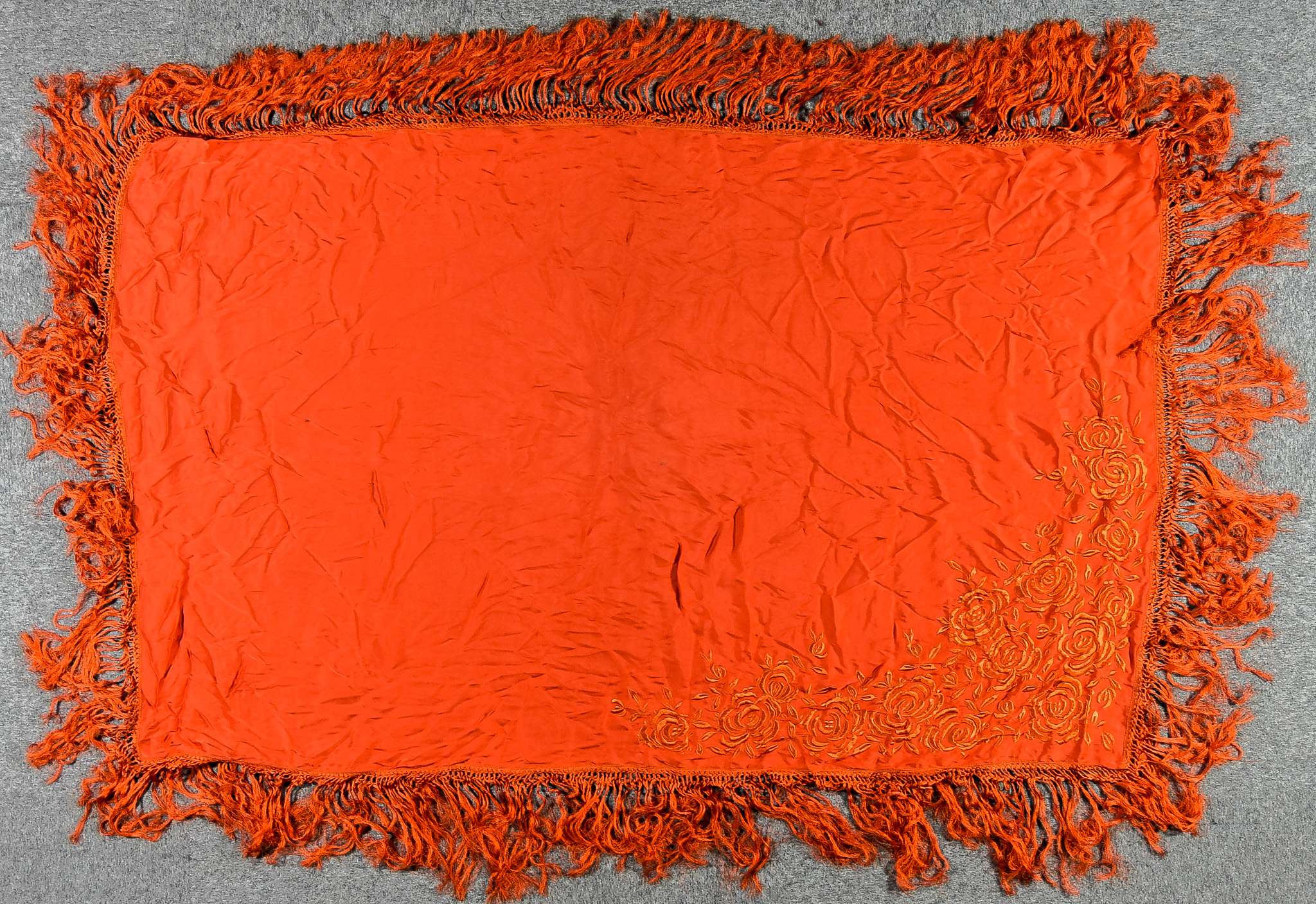 A Chinese Burnt Orange Silk Shawl, finely embroidered with flowers and with fringe to border,