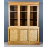 A 20th Century Bleached Wood Bookcase, the upper part with moulded dentil cornice, fitted six