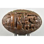 A Carved Nut Oval Snuff Box, 18th/19th Century, the lid carved with figures under a tree, 3.25ins
