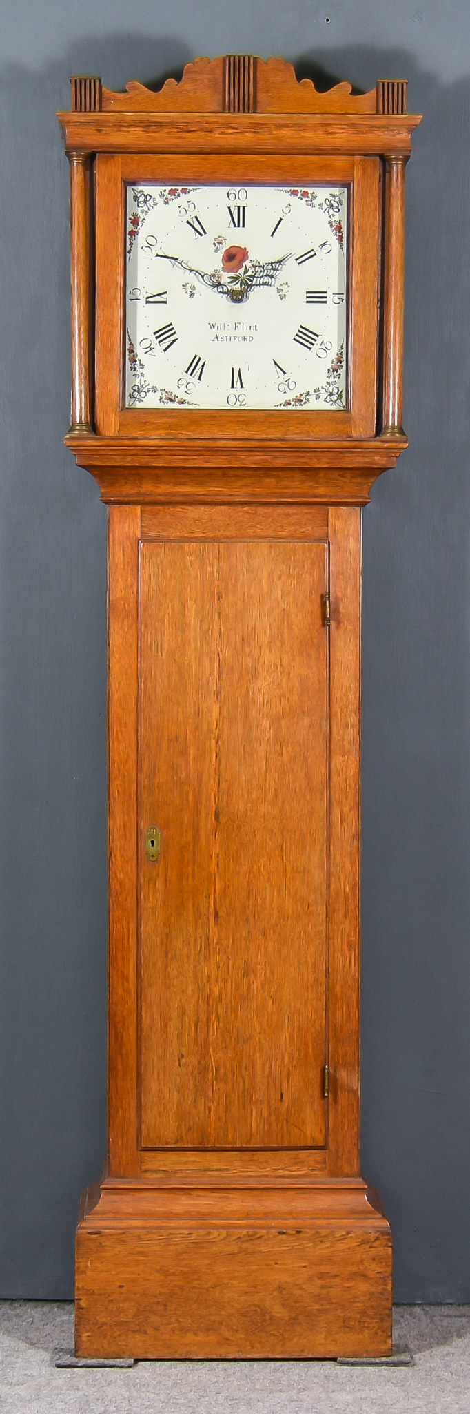 A 19th Century Oak Longcase Clock, by William Flint, the 12ins square painted dial with Roman and