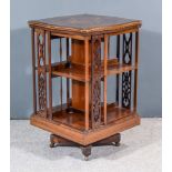 An Edwardian Mahogany Two Tier Revolving Bookcase, of serpentine outline, the top inlaid with bow