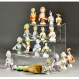 Eighteen Early 20th Century Mostly Continental Porcelain Pincushion Half-Dolls, the largest, a 1920s