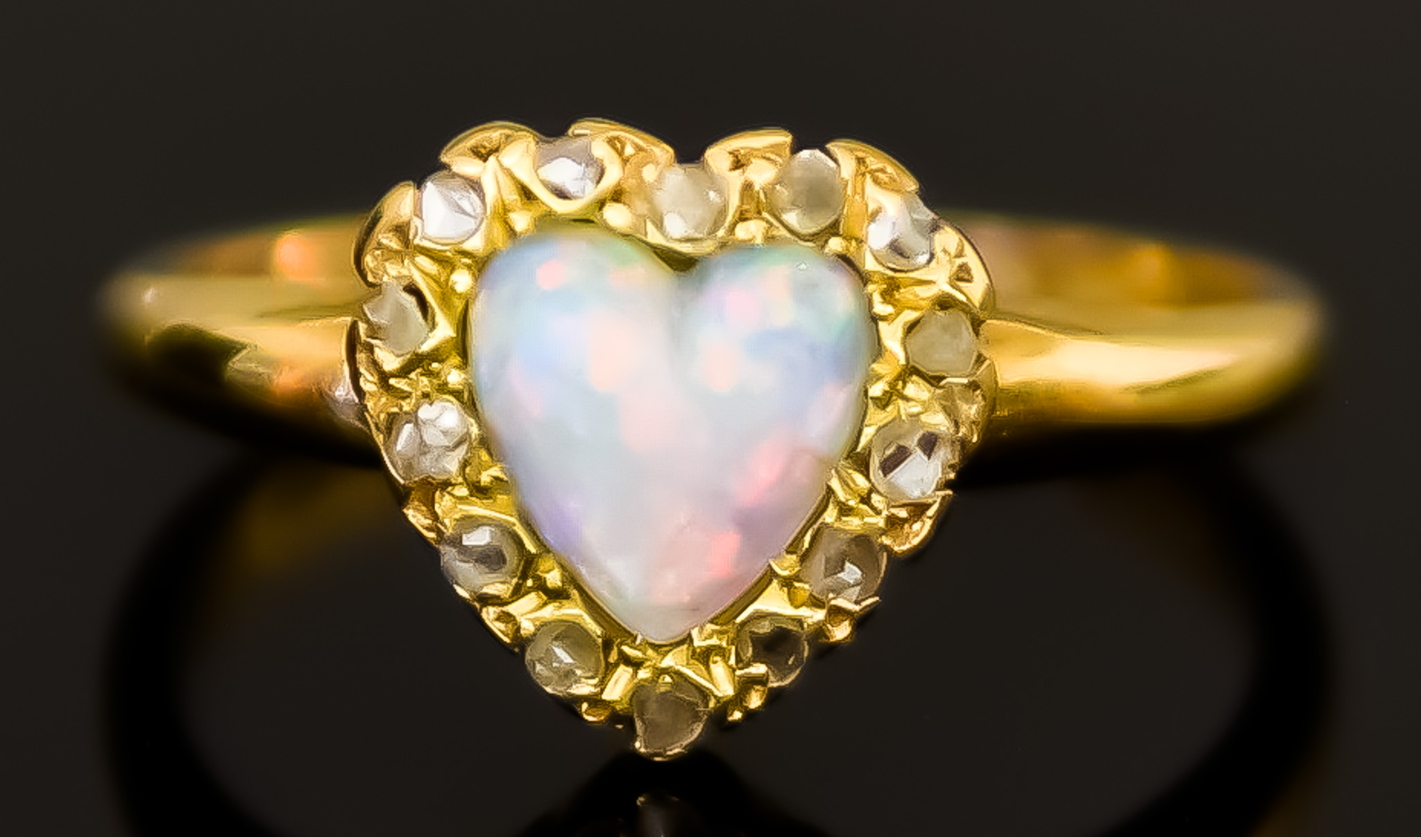 A Yellow Metal Heart Shaped Opal and Diamond Ring, 19th Century, set with a centre opal, 6mm x 6mm