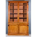 @A Victorian Mahogany Bookcase, the upper part with moulded cornice, fitted eight adjustable shelves