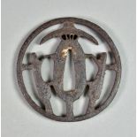 A Japanese Iron Tsuba, sukashi depicting parasols, Edo period (1615-1868), 3ins diameter