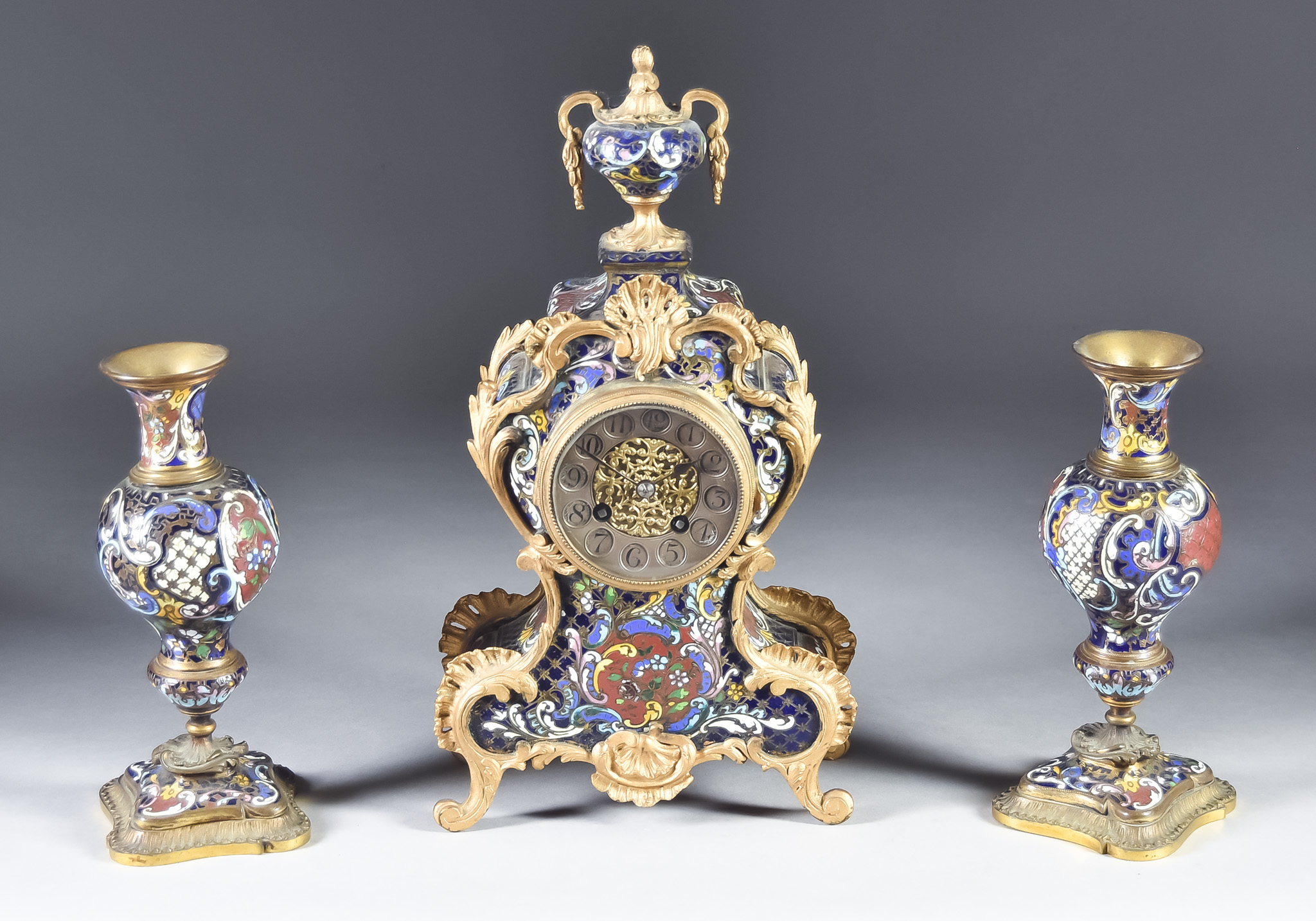 A Late 19th Century French Gilt Metal Mounted and Champleve Clock Garniture, the clock No.11494 with