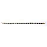 A Sapphire Line Bracelet, Modern, 14ct gold, set with eighteen faceted sapphires, approximately