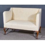 An 18th Century Mahogany Framed Square Back Settee, upholstered in cream cloth, on cabriole legs