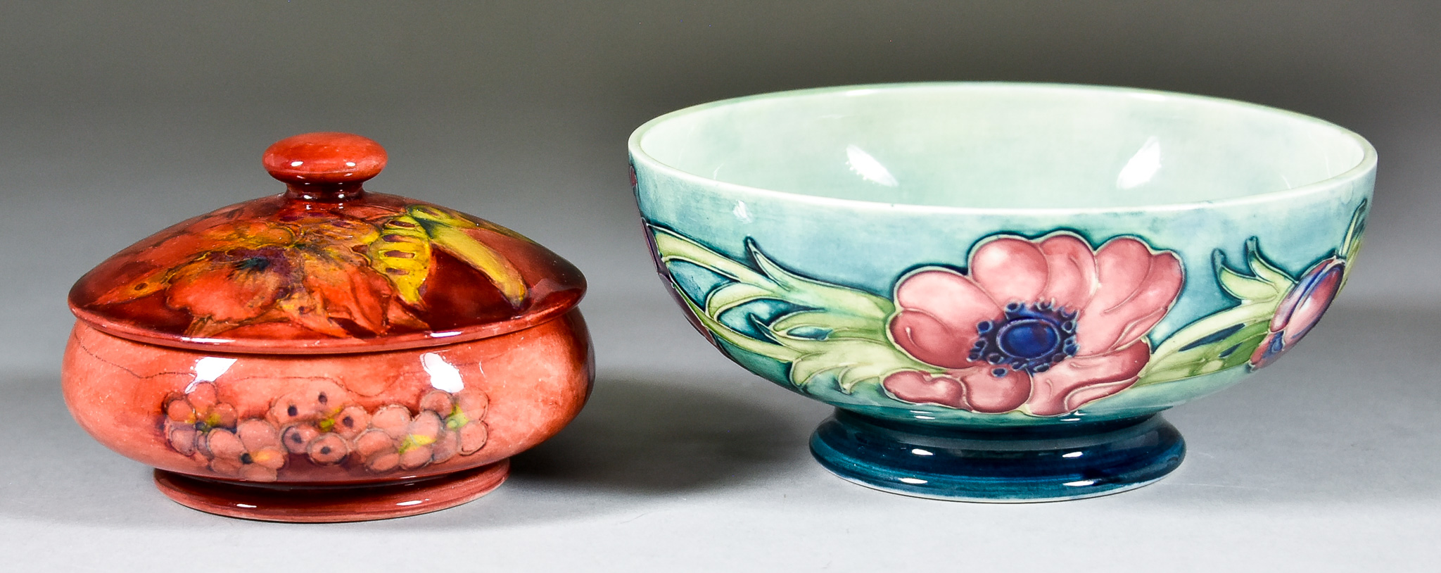 A Moorcroft Pottery Flambé Circular Bowl and Cover, of compressed form, with leaf and berry