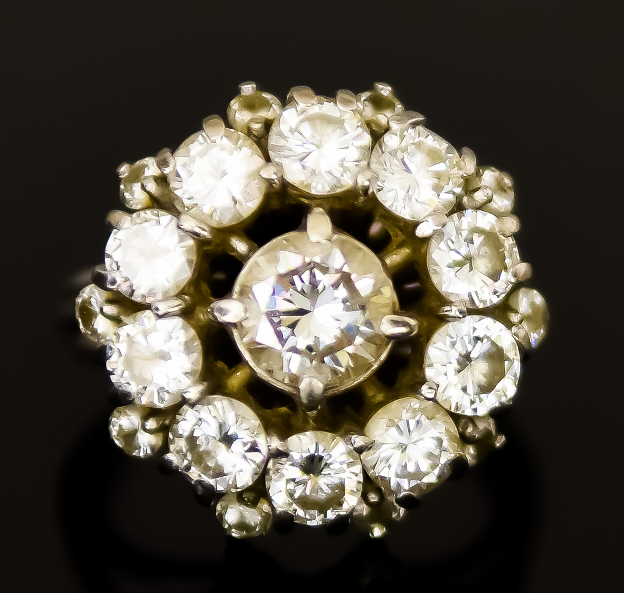 An 18ct White Gold Diamond "Halo"Ring, 20th Century, set with a centre brilliant cut white