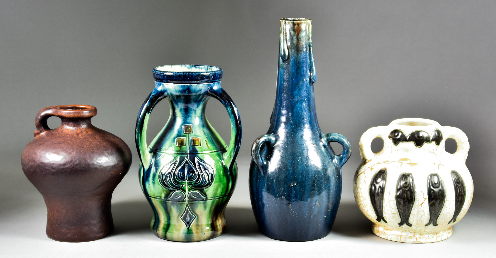 Four Continental Art Studio Pottery Pieces, 20th Century, comprising - a three-handled vase of