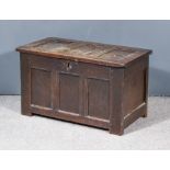 A 17th Century Panelled Oak Coffer with three fielded panels to lid and front 34.5ins wide x 18ins