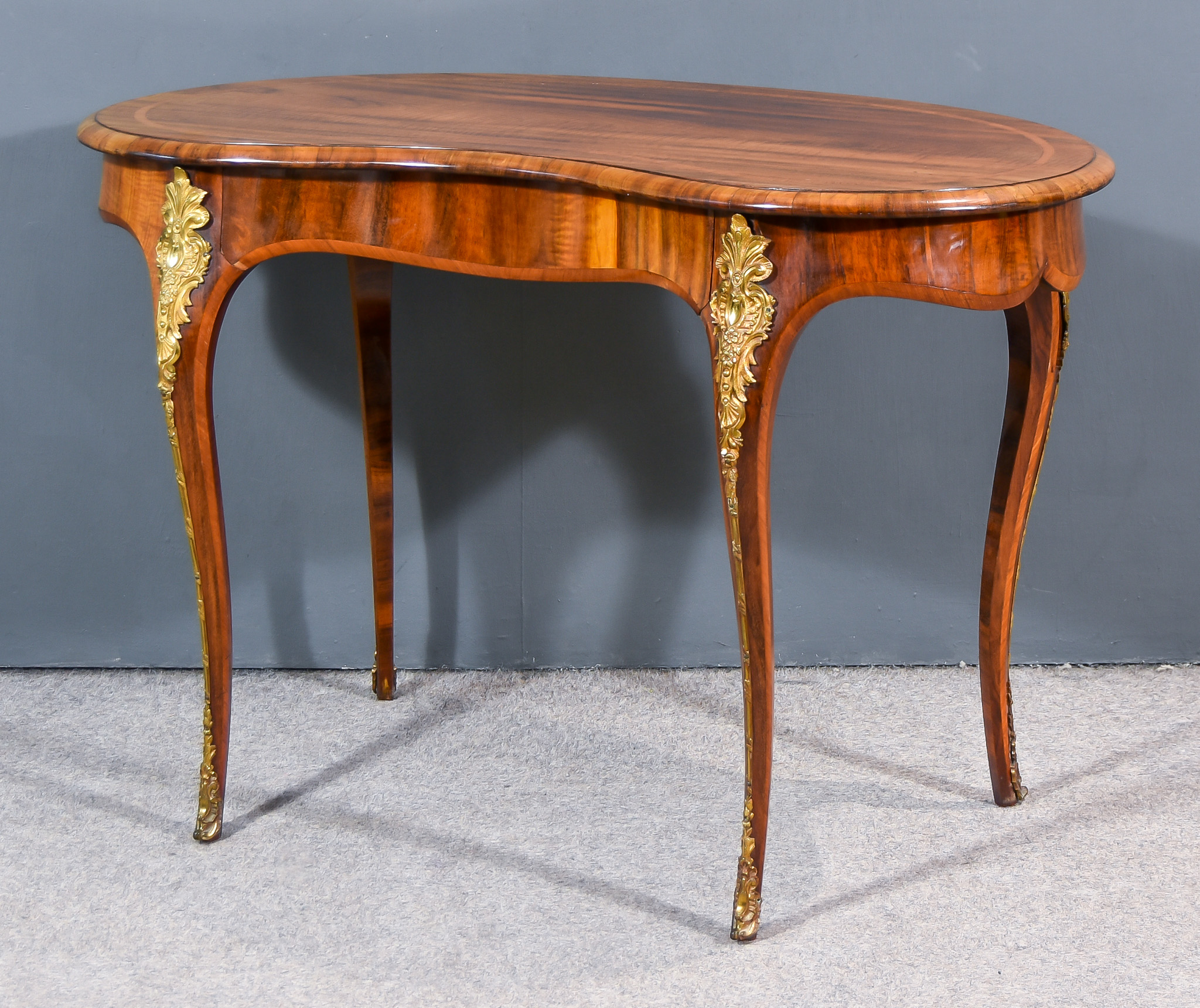 A Victorian Kingwood and Ormolu Mounted Kidney Shaped Table, with paper label for "G. Trollope &