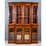 A 19th Century Mahogany Breakfront Bookcase, the upper part with moulded cornice, fitted two shelves