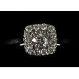An 18ct White Gold Halo Diamond Ring, Modern, set with brilliant cut white diamonds,