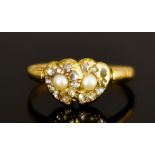 A Small Yellow Metal Lovers Ring in the Regency Manner, in the form of two intertwined hearts,