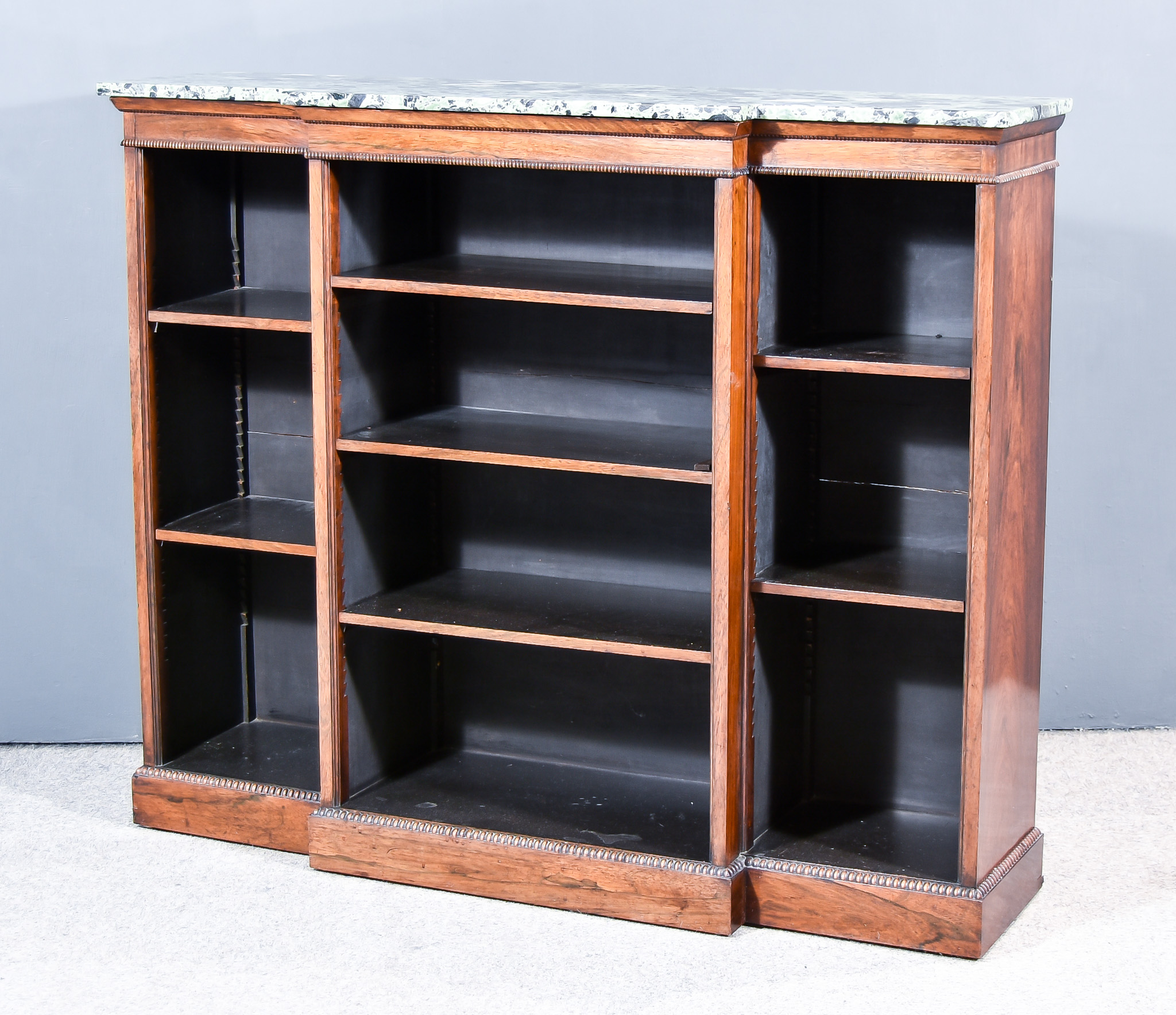 A William IV Rosewood and Break and Open Front Dwarf Bookcase, with green flecked marble slab to