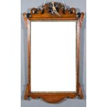 A 19th Century Mahogany Framed Wall Mirror, with shaped cresting and apron, gilt inner slip and
