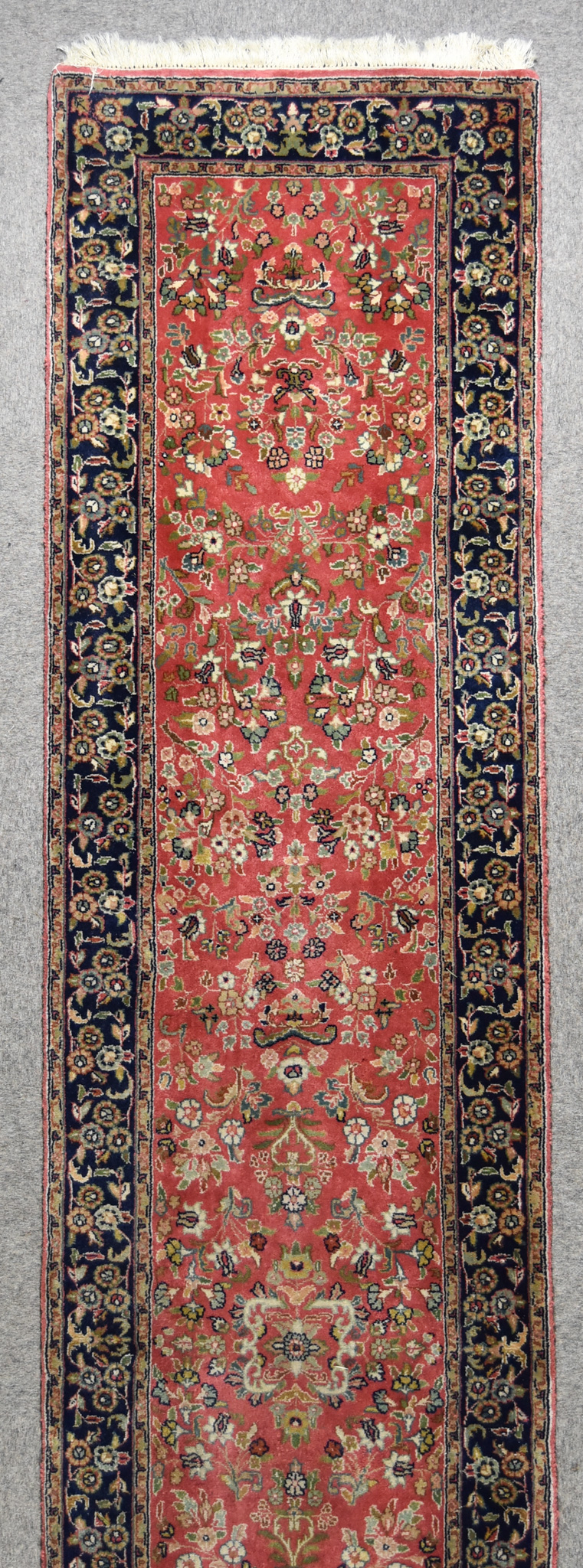 A 20th Century Mehraban Runner, woven in colours of fawn,navy blue and rose, the field filled with