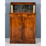 A Regency Rosewood Chiffonier, with tray top shelf on turned supports and plain mirror plate to