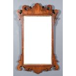 A 19th Century Mahogany Framed Wall Mirror, with shaped cresting and apron, inset with plain