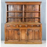 A Late 18th Century Panelled Oak Dresser, the upper part with moulded cornice, fitted three open